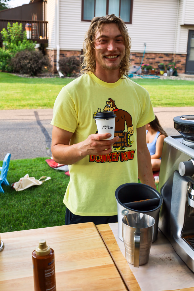 Barista handcrafting a drink at an outdoor Twin Cities event
