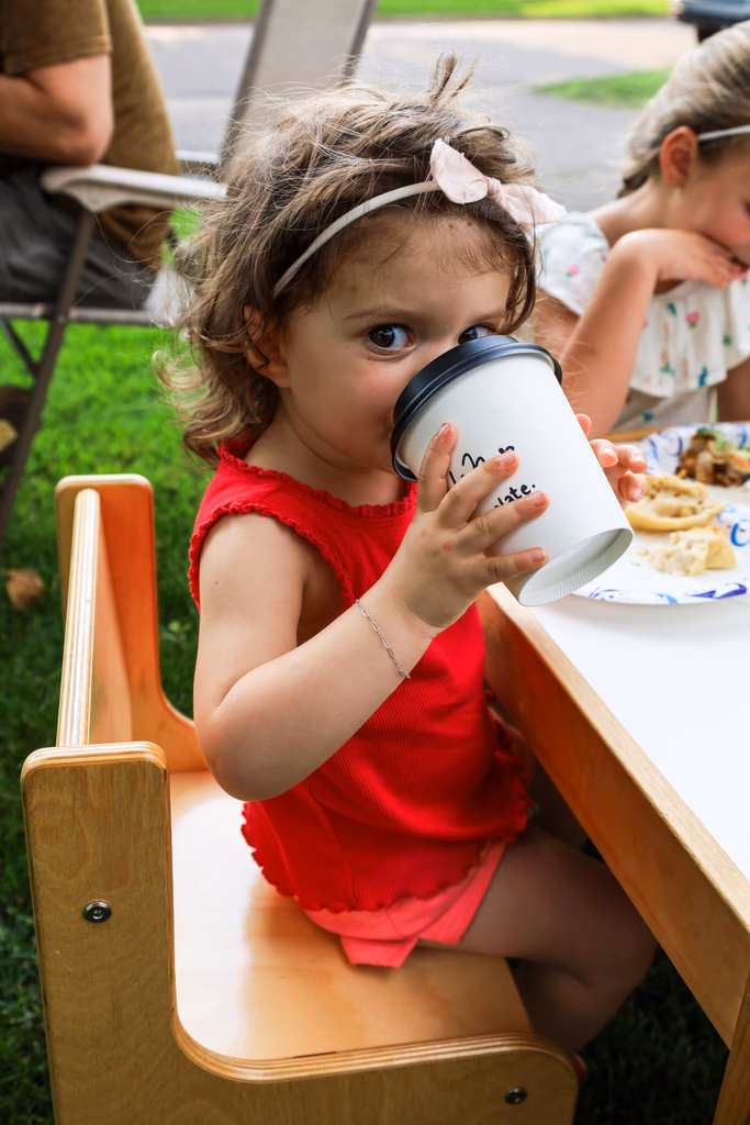 Guest enjoying a handcrafted drink beside the Gondolier Coffee cart
